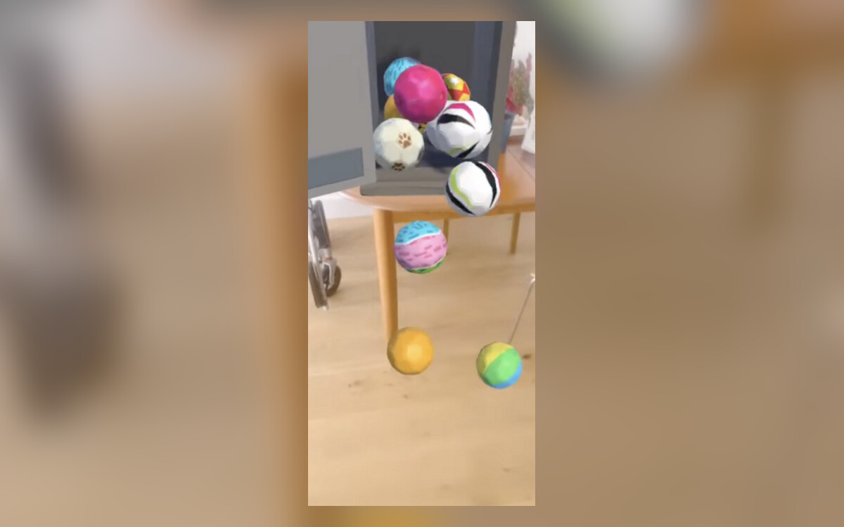 Augmented reality footballs falling from a virtual locker onto a real floor